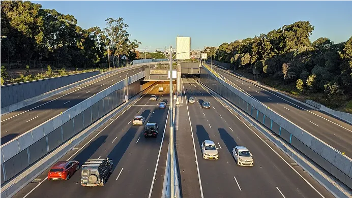 Multi-lane motorway approaching a tunnel portal